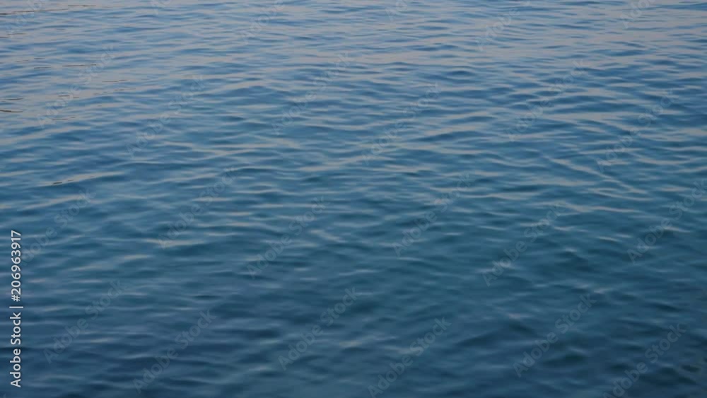 Small waves on the calm sea in the early morning with subtle motion Small waves on the calm sea in the early morning with subtle motion