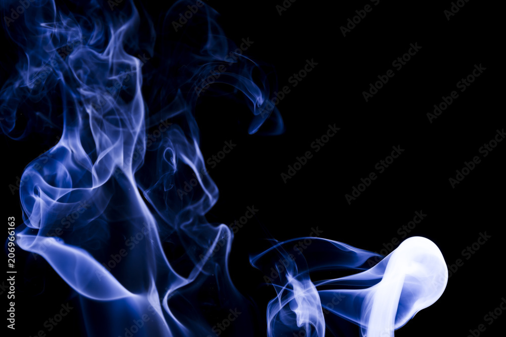 Blue smoke on black background
