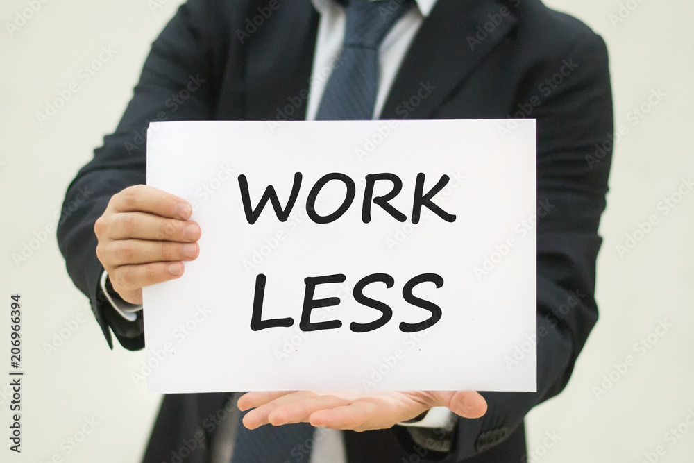 Work Less sign in business man hands Work Less sign in business man hands