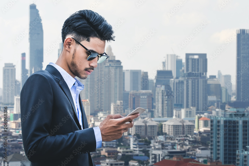 businessman in suit using smartphone at city businessman in suit using smartphone at city