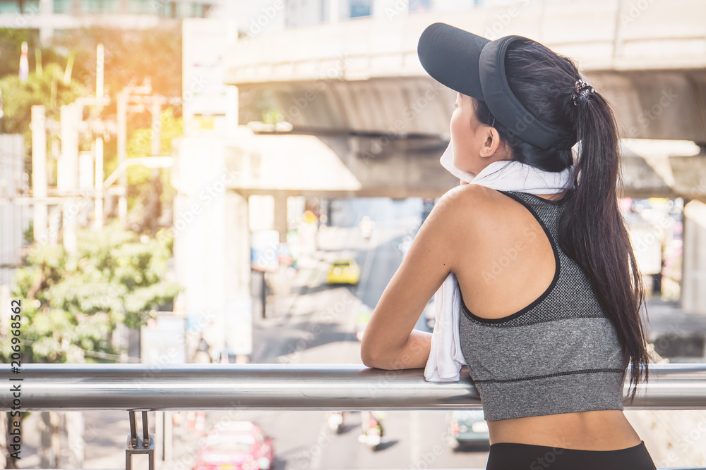 Woman is exercising in the city