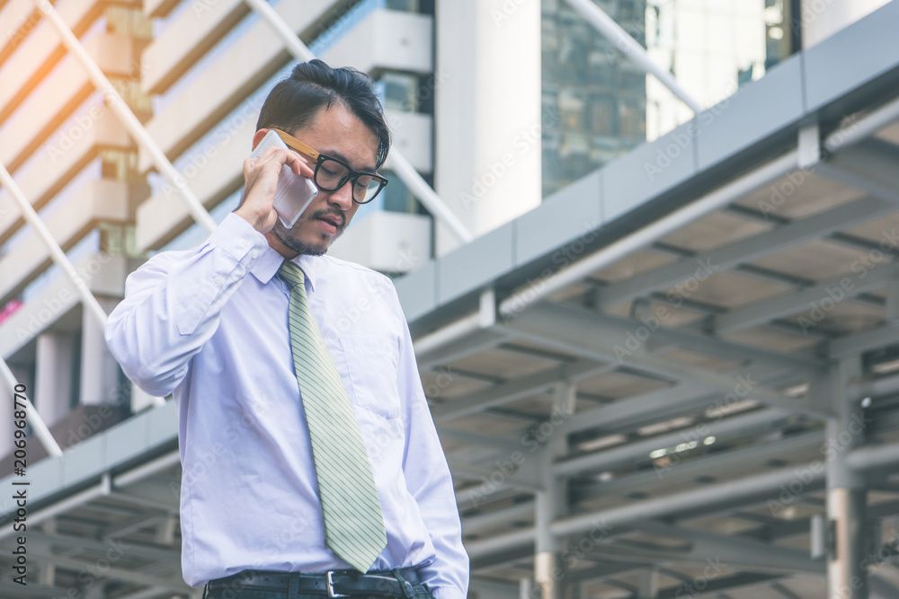 businessman in suit using smartphone at city businessman in suit using smartphone at city