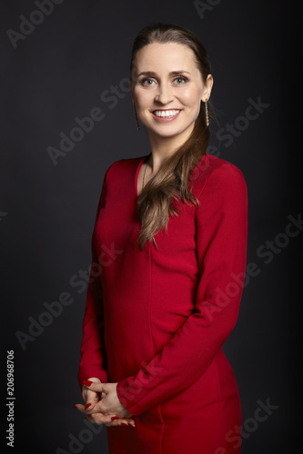 Cheerful woman in red dress