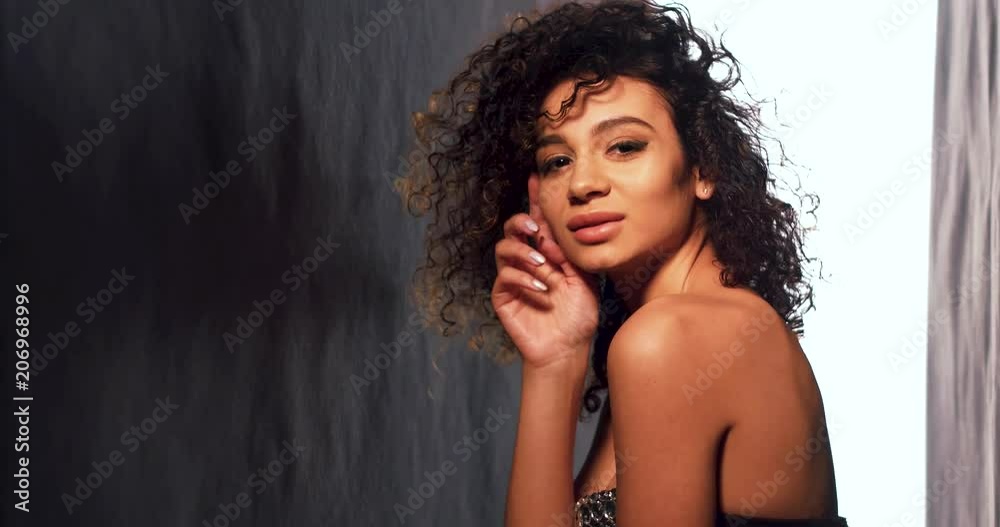Young model in sexy dress with nahed shoulders. Having studio shooting. Beauty concept. Young model in sexy dress with nahed shoulders. Having studio shooting. Beauty concept.