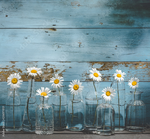 Fototapeta Naklejka Na Ścianę i Meble -  Daisy flower in glass bottles