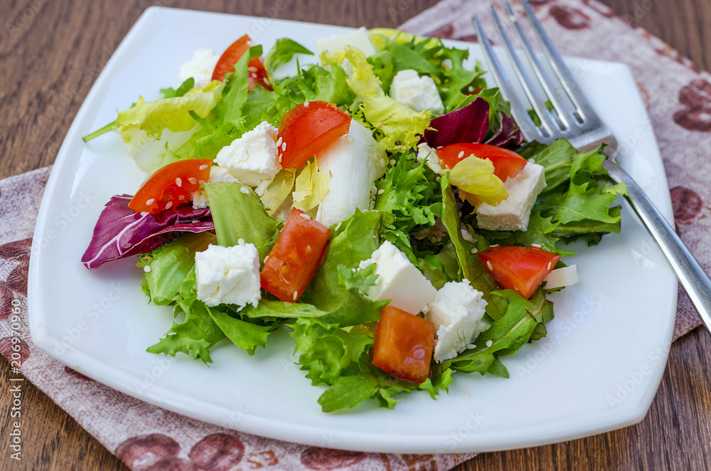 Dietary salad with tomatoes and feta cheese Dietary salad with tomatoes and feta cheese