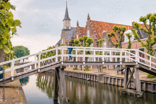 young woman at the Old historical town of Sloten Friesland photo