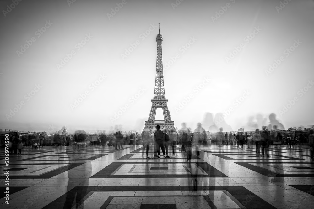 Blurred people on Trocadero square admiring the Eiffel tower, Paris, France
