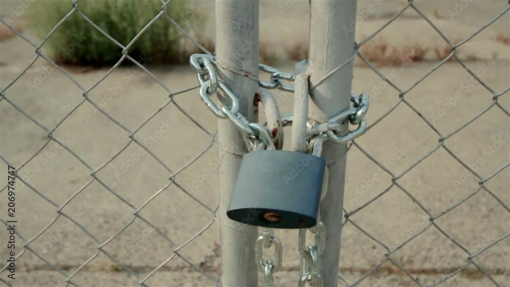 No entry via this padlocked chain linked fence gate. No entry via this padlocked chain linked fence gate.