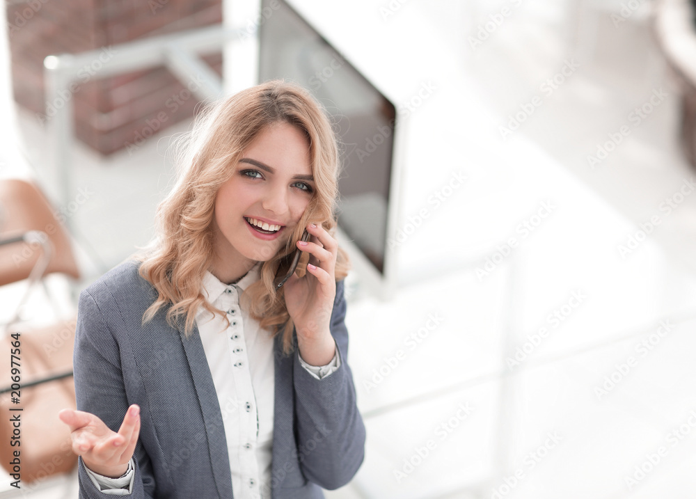 happy employee is talking on the smartphone