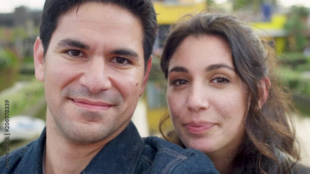 Happy Couple Smile For Portrait On Venice Beach Canal Bridge (Slow Motion) Happy Couple Smile For Portrait On Venice Beach Canal Bridge (Slow Motion)