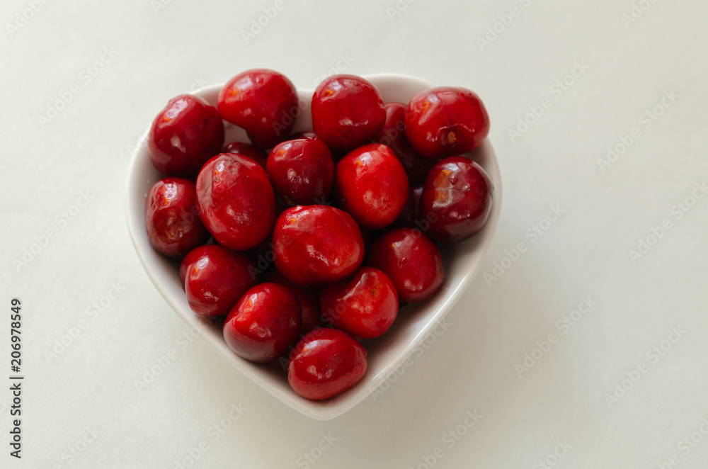 Fresh cherries in bowl on white background Fresh cherries in bowl on white background