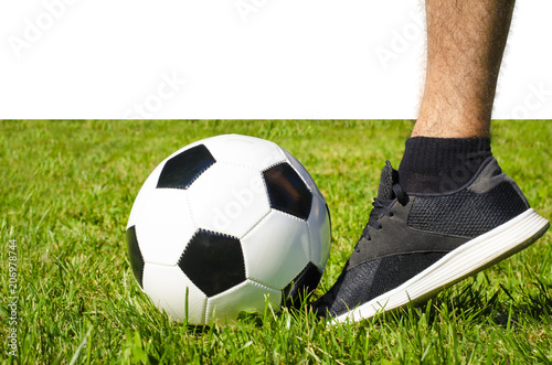 The man s leg in sneakers and soccer ball isolated white background with copy space use for sport and athletic topic