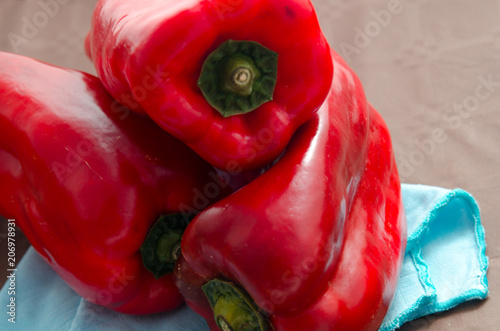 red peppers, on table with brown tablecloth