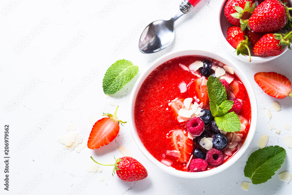 Smoothie bowl with fresh berries and almond. 