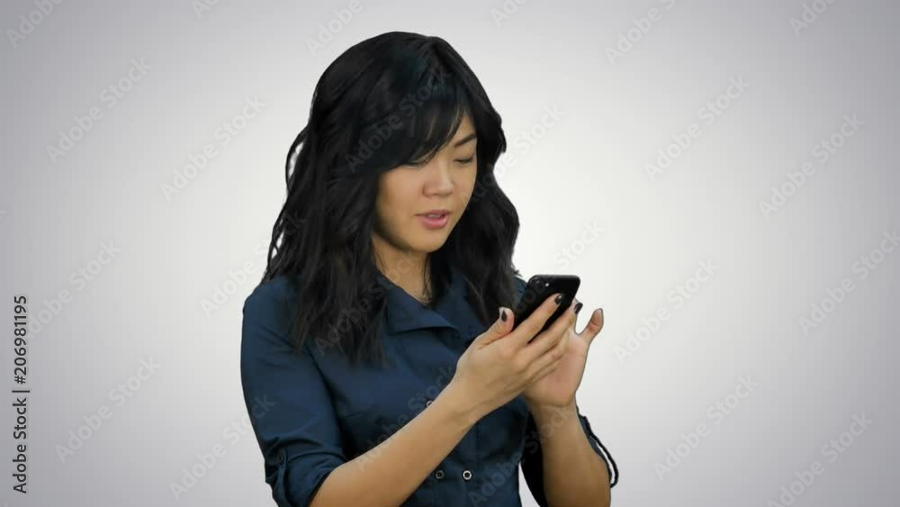Businesswoman using of mobile phone on white background Businesswoman using of mobile phone on white background