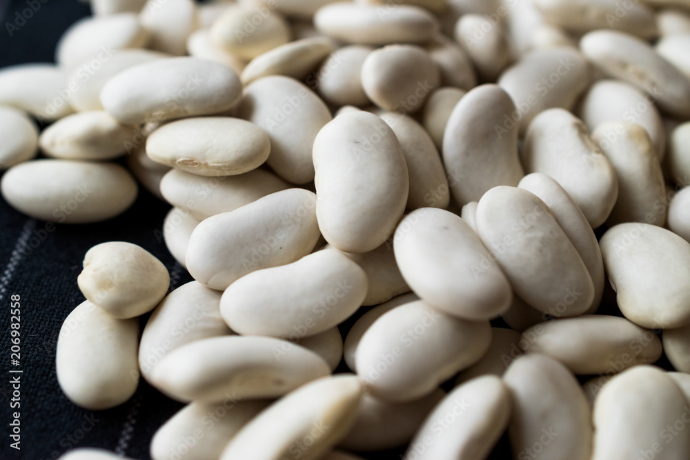 Canellini Navy White Beans on Black Cloth Canellini Navy White Beans on Black Cloth
