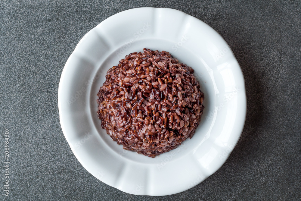 Cooked Black Rice in white Plate with Chopsticks. Cooked Black Rice in white Plate with Chopsticks.