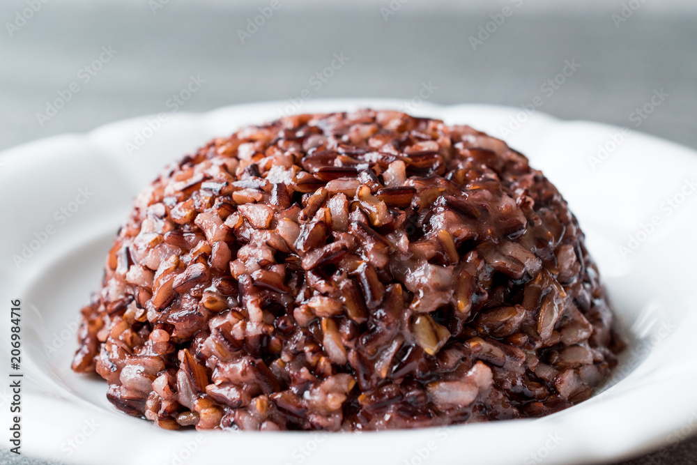 Cooked Black Rice in white Plate with Chopsticks. Cooked Black Rice in white Plate with Chopsticks.