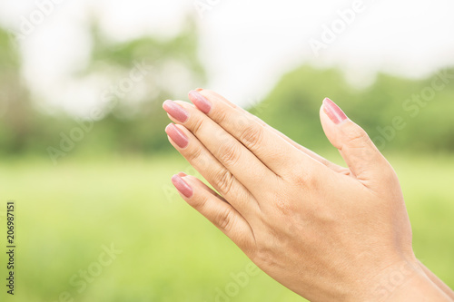 Thai greeting with beautiful woman hand sawasdee to welcome can be use for praying concept  © doucefleur