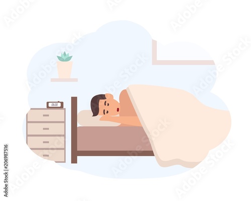 Young man sleeping beside nightstand with electronic alarm clock on it. Male ...