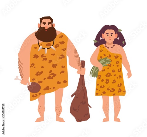 Pair of primitive archaic man and woman dressed in fur clothes and standing together