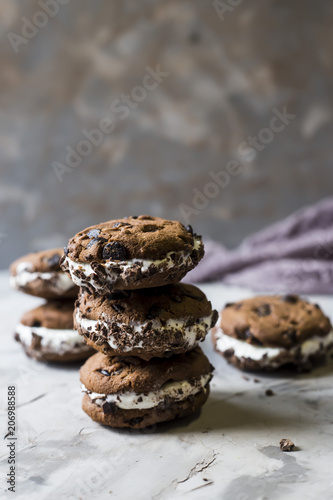 Sandwich ice cream with chocolate cookies on a gray background. Summer dessert concept