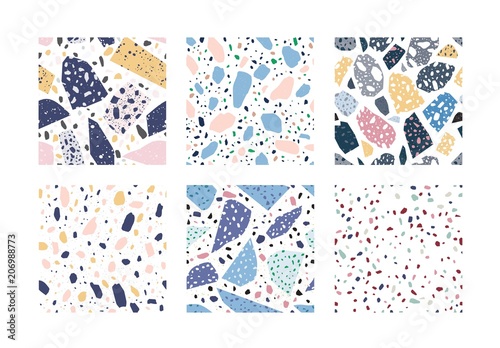Collection of terrazzo geometric textures. Bundle of seamless patterns with colorful splinters or sprinkles on white background. Creative vector illustration for backdrop, textile print, flooring.
