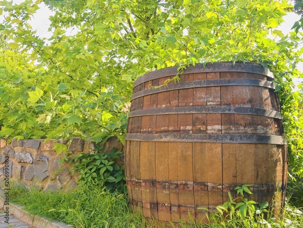 Old rustic wine barrel. Wine background in Europe. Czech Republic, South Moravia Old rustic wine barrel. Wine background in Europe. Czech Republic, South Moravia