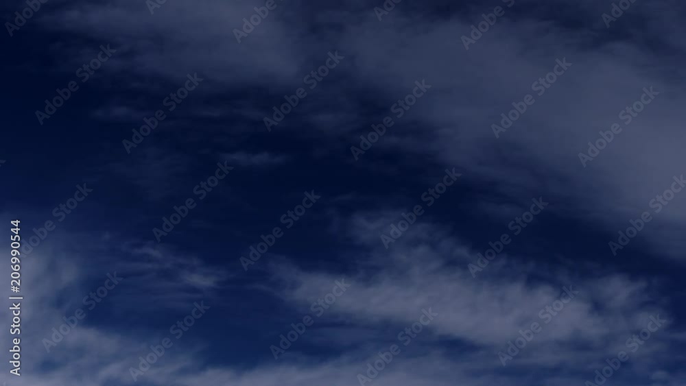 Flying inside the clouds in the sky. Deep blue sky for a background. Clouds moving fast and close Flying inside the clouds in the sky. Deep blue sky for a background. Clouds moving fast and close