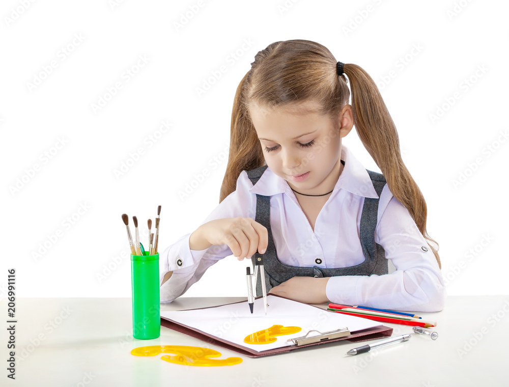 little young girl with compass at the table little young girl with compass at the table