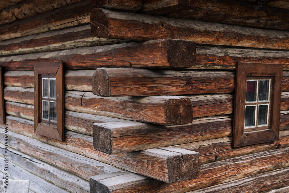 ancient wooden wall and window, of Cossack state guard army troop 16-18 centuries. Khortytsia island on broad Dnipro summertime, vintage houses construction technology background ancient wooden wall and window, of Cossack state guard army troop 16-18 centuries. Khortytsia island on broad Dnipro summertime, vintage houses construction technology background