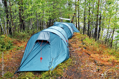 Obraz na płótnie Several large tents in the taiga on the shore of the reservoir w salonie
