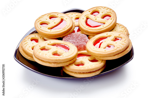 Smile biscuits with red jelly. Isolated on a white background.