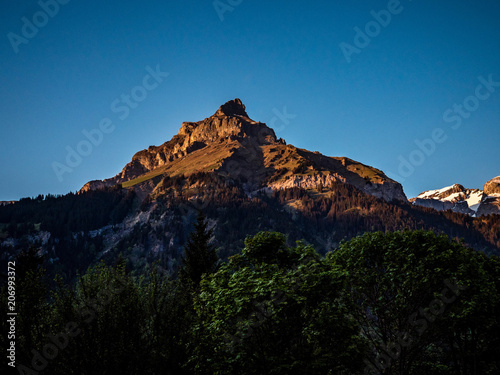 Fototapeta Naklejka Na Ścianę i Meble -  mountain peak in golden light, sunset