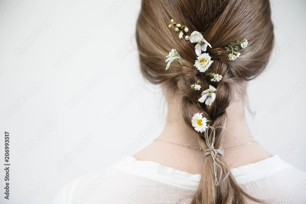 Hairstyle with fresh white flowers. Wedding hairstyle. Hair braided. Stock  Photo | Adobe Stock