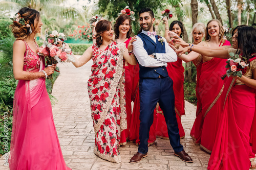 Funny scenes with bridesmaids trying to keep Hindu bride away from groom