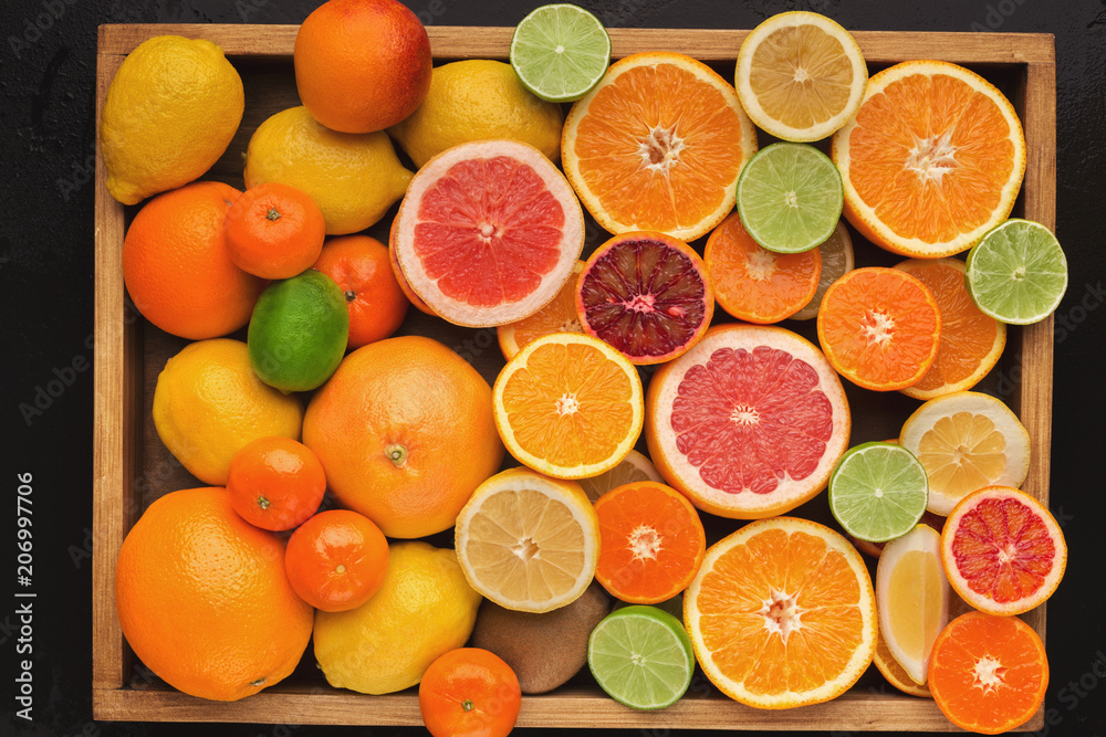 Assorted cirtus fruits background, top view Assorted cirtus fruits background, top view