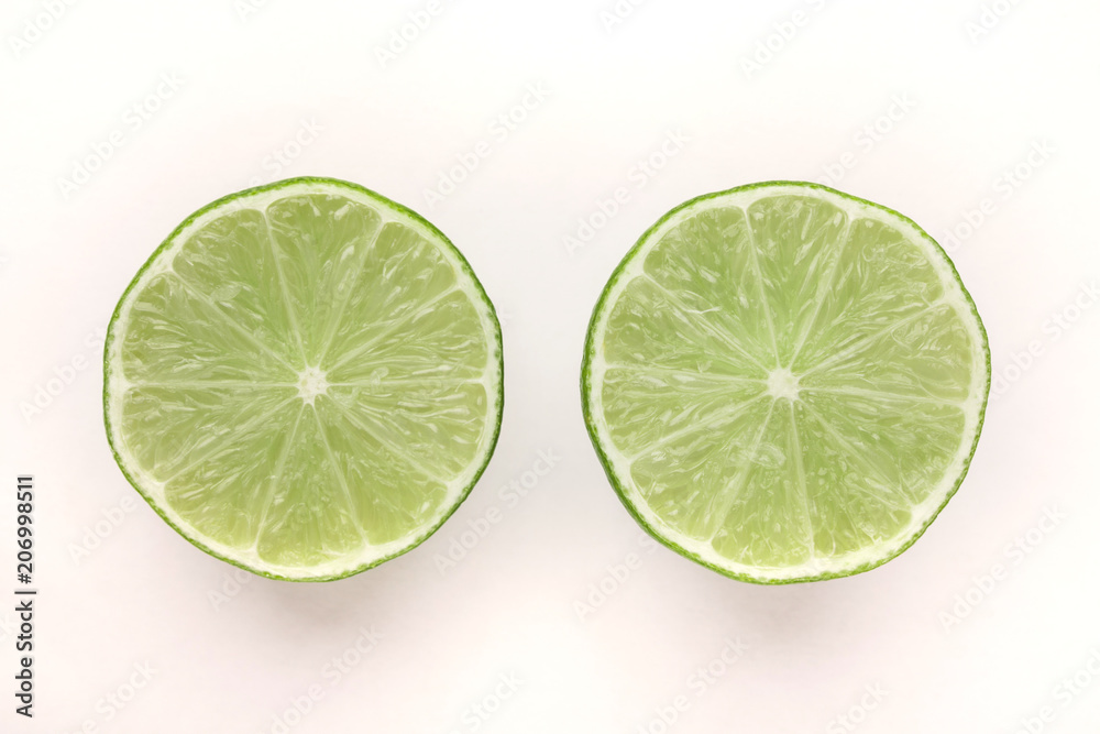 Halves of lime isolated on white background