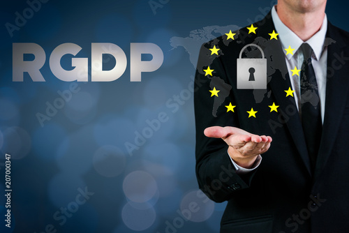 RGDP cyber security 2018 with a man showing a lock and european stars flag on a blue background photo