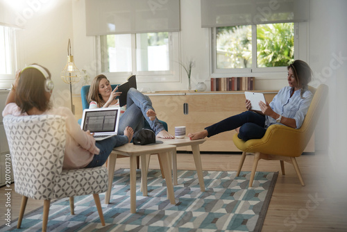 Roommates talking together in living-room photo