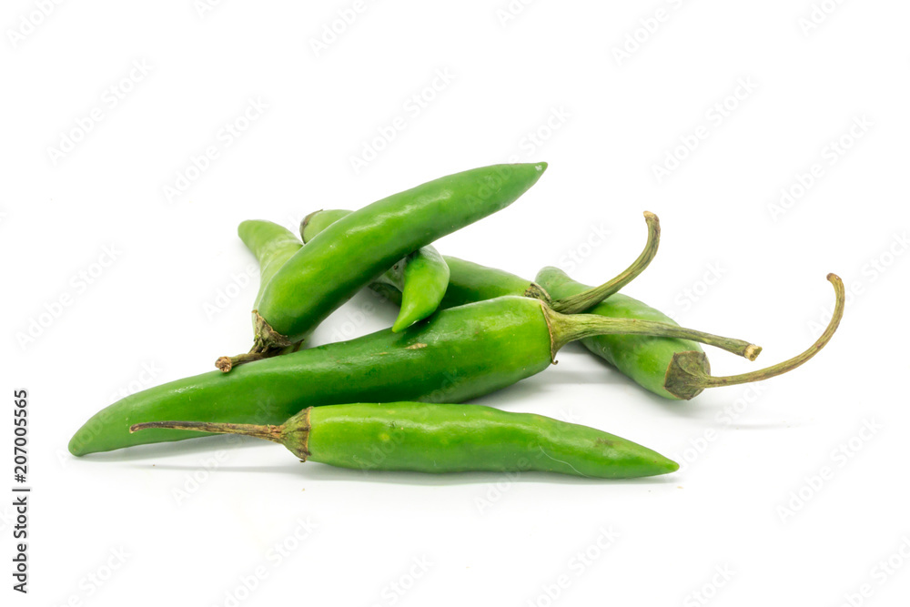 Green finger chillies against a white background Green finger chillies against a white background