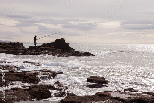 Obraz na płótnie pesca en la playa caleta w salonie