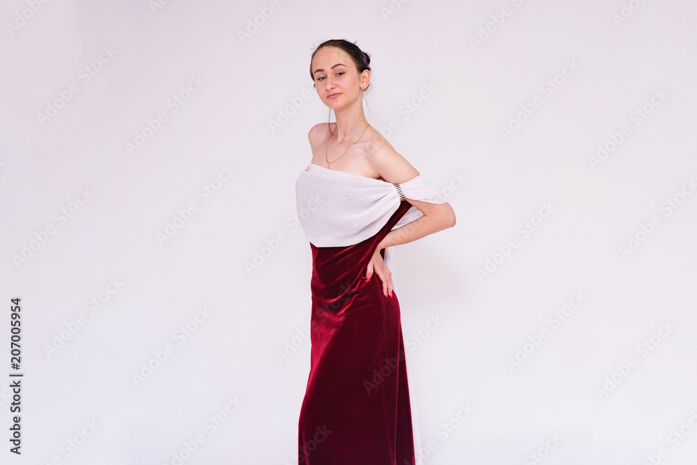 portrait of a beautiful brunette girl on a white background in a dress in different poses showing different emotions portrait of a beautiful brunette girl on a white background in a dress in different poses showing different emotions