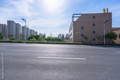 empty asphalt road with modern office building