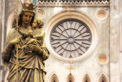 Regina Pacis (Queen of Peace) Statue in front of St. Joseph's Cathedral, Hanoi, Vietnam. St. Joseph's Cathedral is a Neogothic style church that serves as the cathedral of the Roman Catholic photo
