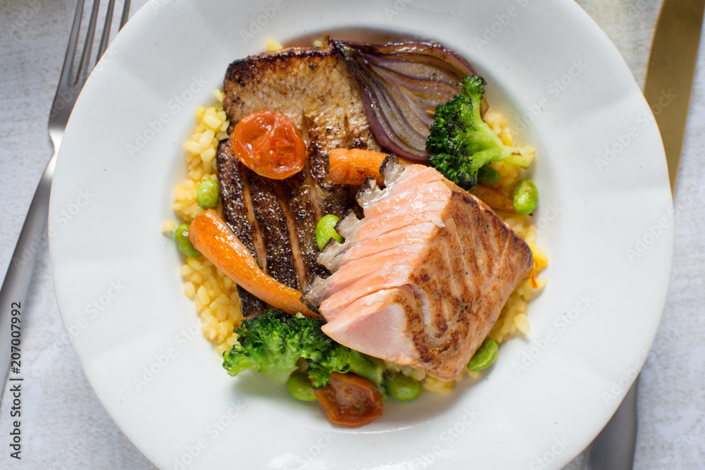Grilled Salmon Fillet with Vegetables on White Plate Grilled Salmon Fillet with Vegetables on White Plate