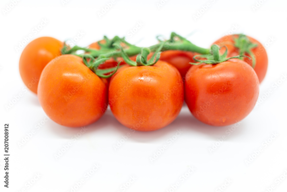 Red tomatoes against a white background Red tomatoes against a white background