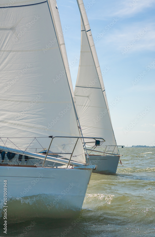 Two Sailing Boat Yachts at sea Two Sailing Boat Yachts at sea