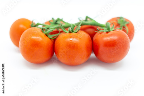 Red tomatoes against a white background